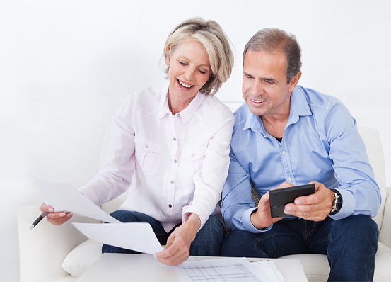 Older couple calculating retirement